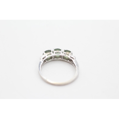 152 - 9ct gold diamond and green gemstone trilogy ring (2g) size  N