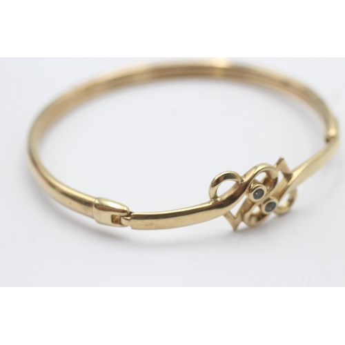 165 - 9ct gold topaz double heart openwork bangle by clogau (12.1g)