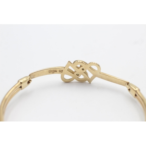 165 - 9ct gold topaz double heart openwork bangle by clogau (12.1g)