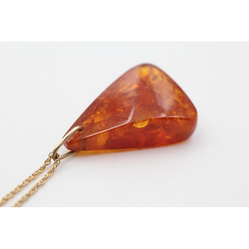 184 - 9ct gold bailed vintage amber pendant necklace (6.1g)