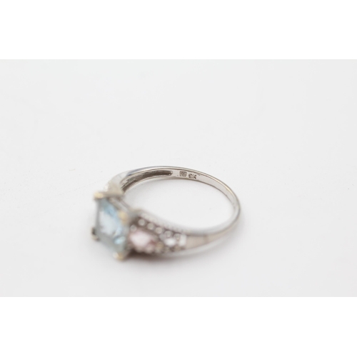 197 - 9ct white gold diamond, aquamarine, and pink gemstone dress ring (2.6g) size  P