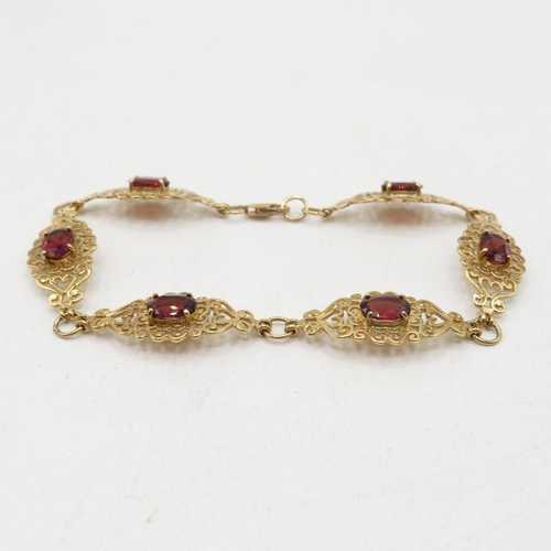 203 - 9ct gold heart fretwork panel bracelet with garnet inserts   7