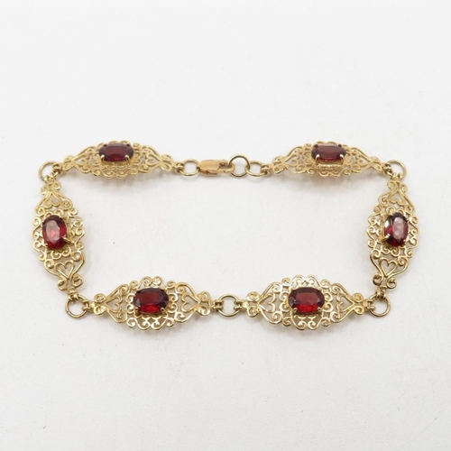 203 - 9ct gold heart fretwork panel bracelet with garnet inserts   7