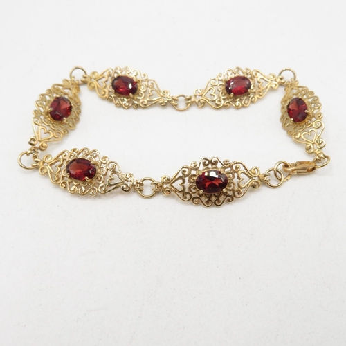 203 - 9ct gold heart fretwork panel bracelet with garnet inserts   7