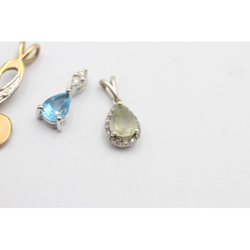 32 - 3 x 9ct gold diamond pendants inc. aquamarine, topaz (2.4g)