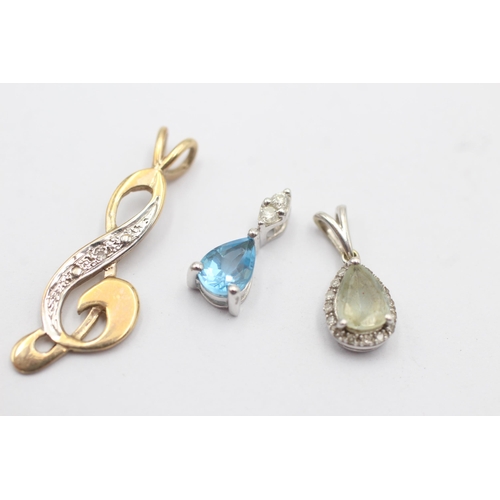 32 - 3 x 9ct gold diamond pendants inc. aquamarine, topaz (2.4g)