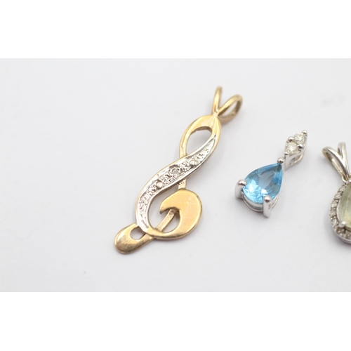 32 - 3 x 9ct gold diamond pendants inc. aquamarine, topaz (2.4g)