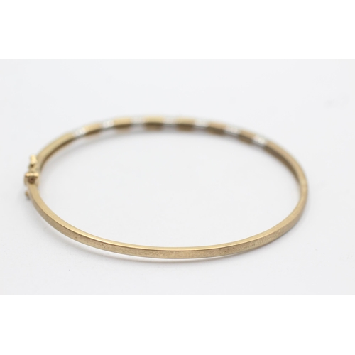 35 - 9ct gold bangle with diamond spacers (8.5g)