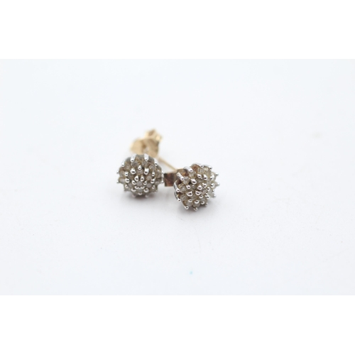 37 - 2 x 9ct gold diamond cluster paired earrings (2.5g)