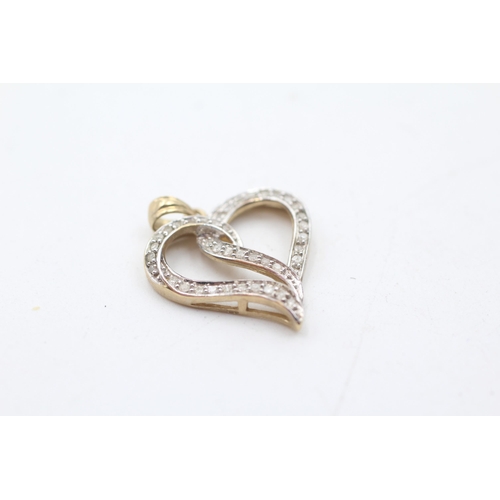 49 - 2 x 9ct gold diamond heart pendants (3.5g)