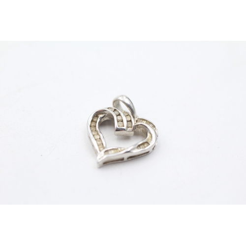 49 - 2 x 9ct gold diamond heart pendants (3.5g)