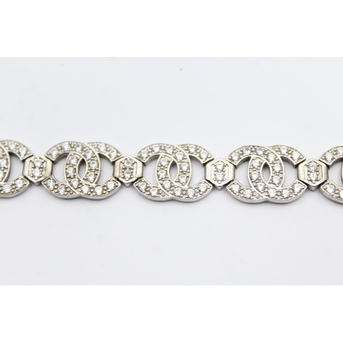 54 - 9ct gold clear gemstone panel bracelet (16.2g)