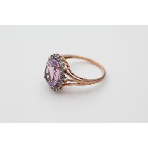 60 - 9ct gold amethyst and clear gemstone halo set dress ring (2.7g) size  O