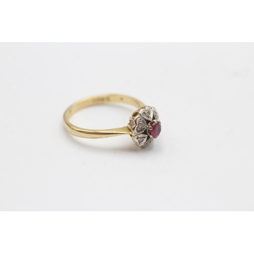 74 - 18ct gold diamond & red gemstone halo ring with heart motif (3.7g)