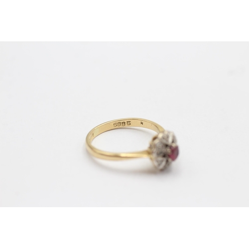 74 - 18ct gold diamond & red gemstone halo ring with heart motif (3.7g)