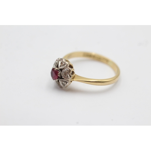 74 - 18ct gold diamond & red gemstone halo ring with heart motif (3.7g)