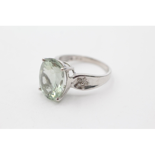 92 - 9ct white gold diamond & prasiolite shoulder set ring (5.7g)