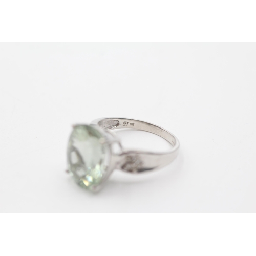 92 - 9ct white gold diamond & prasiolite shoulder set ring (5.7g)