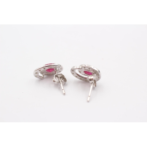 44 - 9ct White Gold Ruby And Diamond Halo Stud Earrings (1.4g)