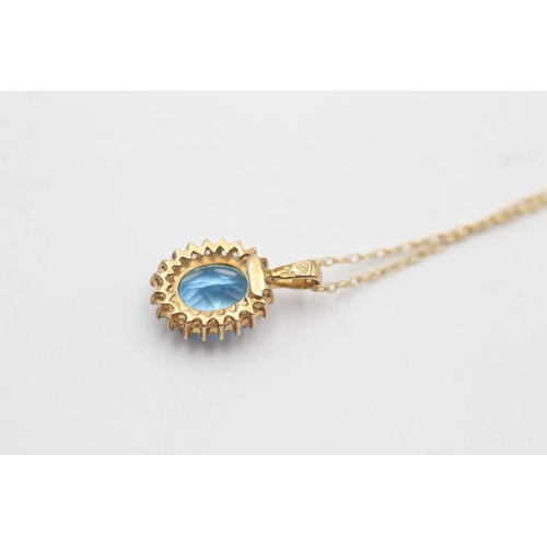 46 - 9ct Gold Topaz And White Gemstone Halo Pendant On Chain (2.4g)