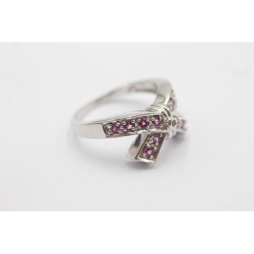 57 - 9ct White Gold Pink Gemstone Bow Cross Over Ring (4.4g)Size N