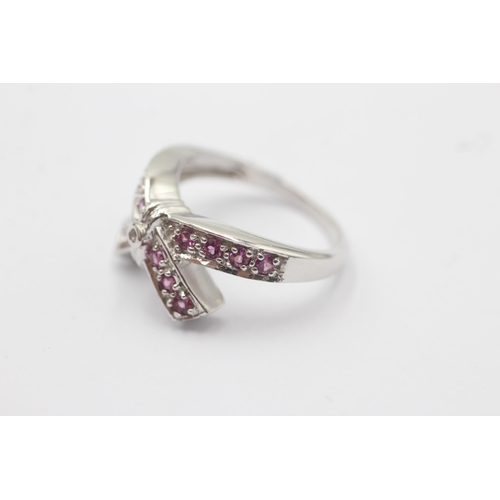 57 - 9ct White Gold Pink Gemstone Bow Cross Over Ring (4.4g)Size N