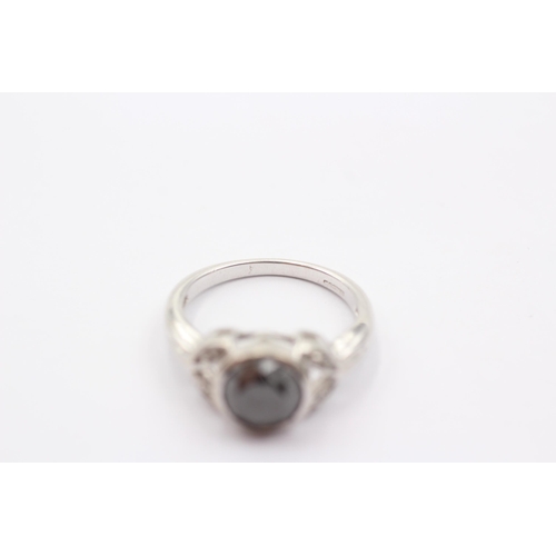 58 - 9ct White Gold Diamond And Black Gemstone Ring (4.3g)Size N