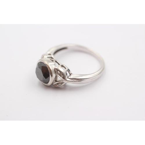 58 - 9ct White Gold Diamond And Black Gemstone Ring (4.3g)Size N