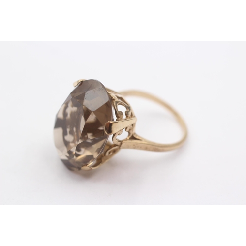1 - 9ct Gold Oval Smoky Quartz High Profile Ornate Basket Setting Cocktail Ring (10g) Size R