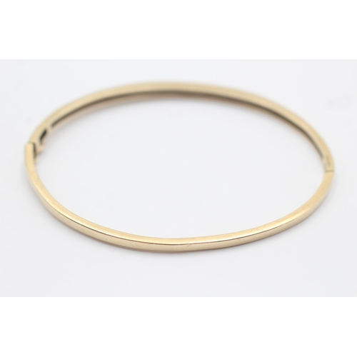 31 - 10ct Gold Diamond Channel Set Half Eternity Hinged Bangle Bracelet (7.5g)