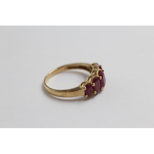 124 - 9ct Gold Glass-Filled Ruby Five Stone Ring (2.9g) size  O+1/2