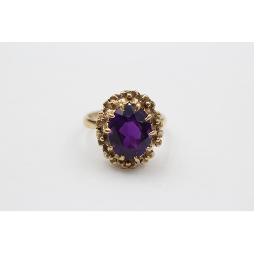 149 - 9ct Gold Amethyst Single Stone Ring With Floral Frame (3.7g) size  J