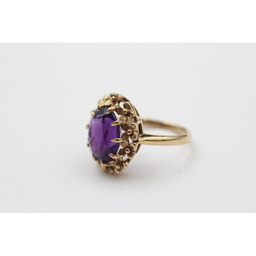 149 - 9ct Gold Amethyst Single Stone Ring With Floral Frame (3.7g) size  J