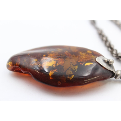 176 - A Modernist Silver Statement Amber Pendant Necklace (49g)