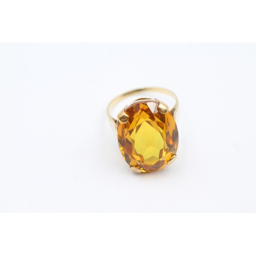 66 - 9ct Gold Yellow Synthetic Sappire Single Stone Cocktail Ring (8.4g) size  Q