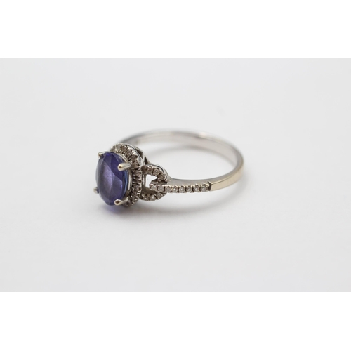 81 - 14ct White Gold Tanzanite Single Stone Ring With Diamond Surrounds & Shank (3.1g) size  M