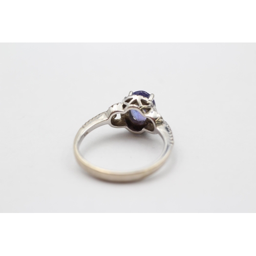 81 - 14ct White Gold Tanzanite Single Stone Ring With Diamond Surrounds & Shank (3.1g) size  M