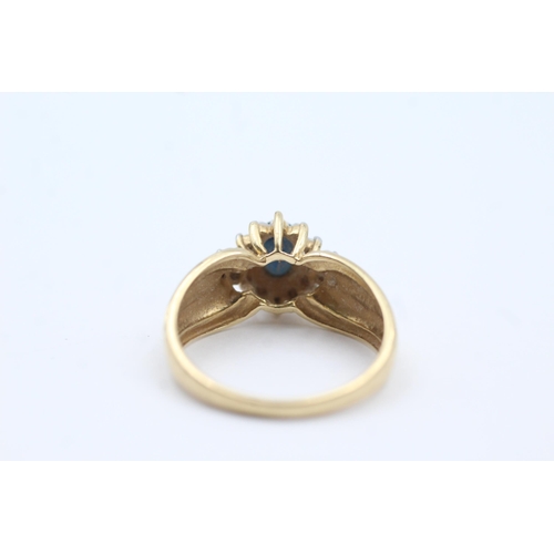 117 - 9ct Gold Sapphire Single Stone Ring With Diamond Surround (3.2g)