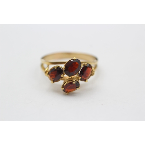 127 - 18ct Gold Garnet Four Stone Dress Ring (3.9g) size P