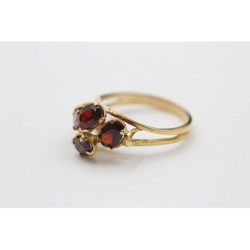 127 - 18ct Gold Garnet Four Stone Dress Ring (3.9g) size P