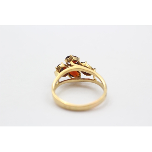 127 - 18ct Gold Garnet Four Stone Dress Ring (3.9g) size P