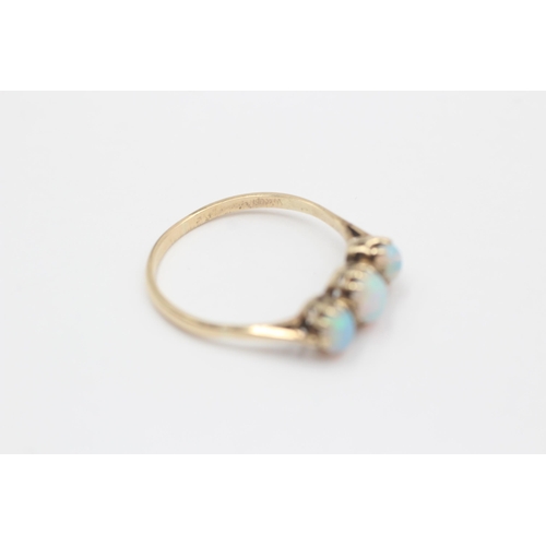 130 - 9ct Gold White Opal Three Stone Ring (2g) size R