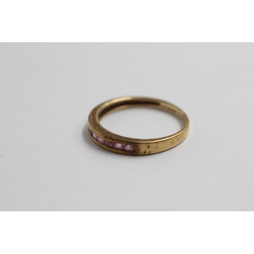 43 - 9ct Gold Pink Sapphire Nine Stone Band Ring (1.8g) size Q