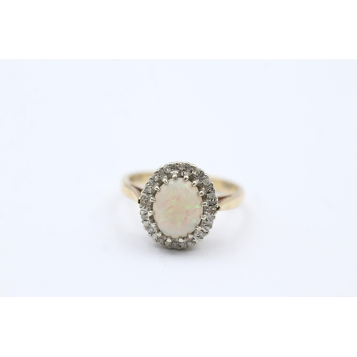 53 - 9ct Gold Diamond & White Opal Oval Halo Ring (3.3g) size O