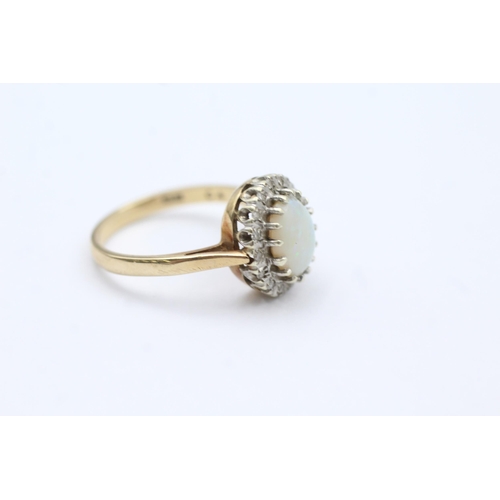 53 - 9ct Gold Diamond & White Opal Oval Halo Ring (3.3g) size O