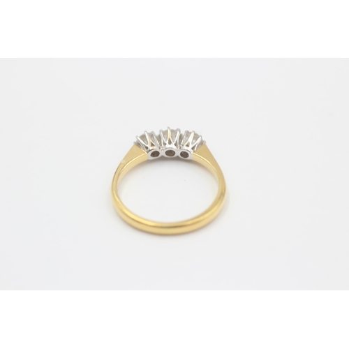 77 - 18ct Gold Round Cut Diamond Three Stone Ring (3.1g) size M