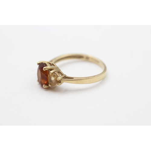 79 - 9ct Citrine Three Stone Ring (2.1g) size M