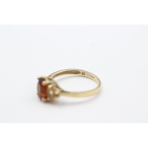 79 - 9ct Citrine Three Stone Ring (2.1g) size M