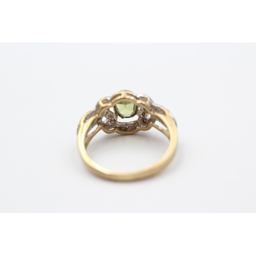 85 - 9ct Gold Peridot Single Stone Ring With Diamond Surrounds (2.3g) size J