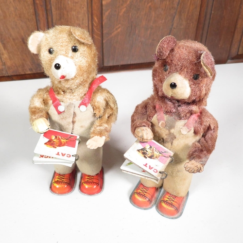 288 - 2x mechanical tin plate teddy bears reading books - both running  7